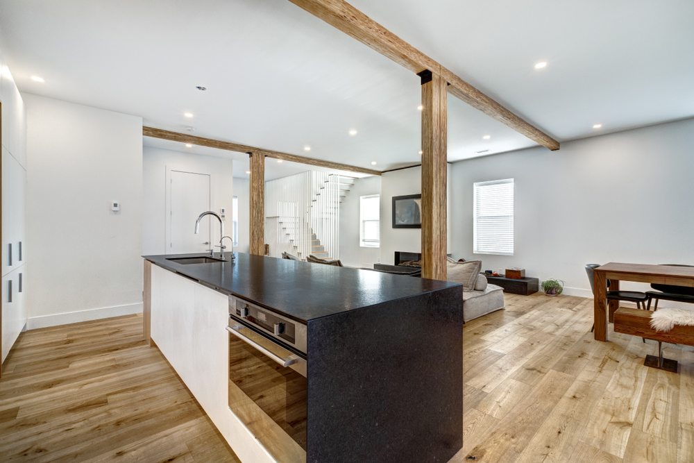 Finished basement with bright windows and kitchen island