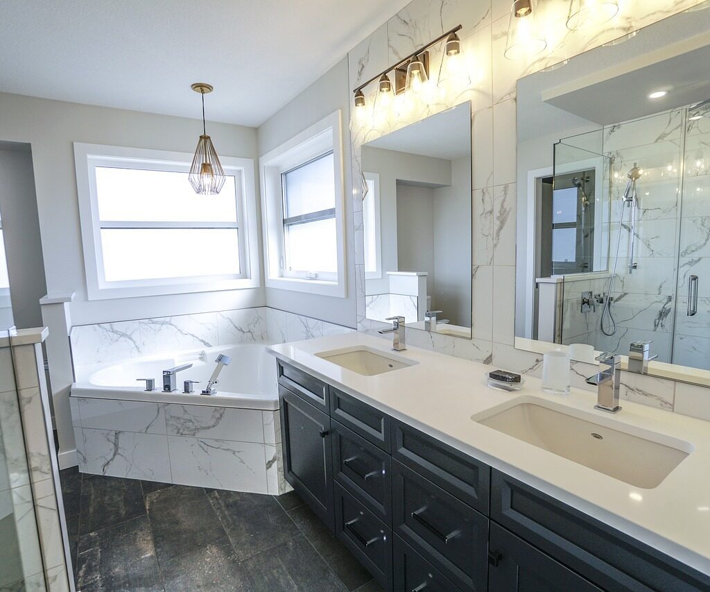 Luxurious master bathroom with marble soaking tub and shower