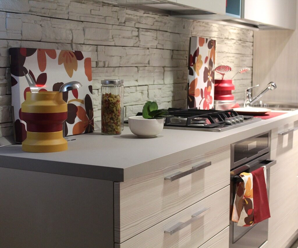 Gray kitchen countertop with gray brick kitchen backsplash