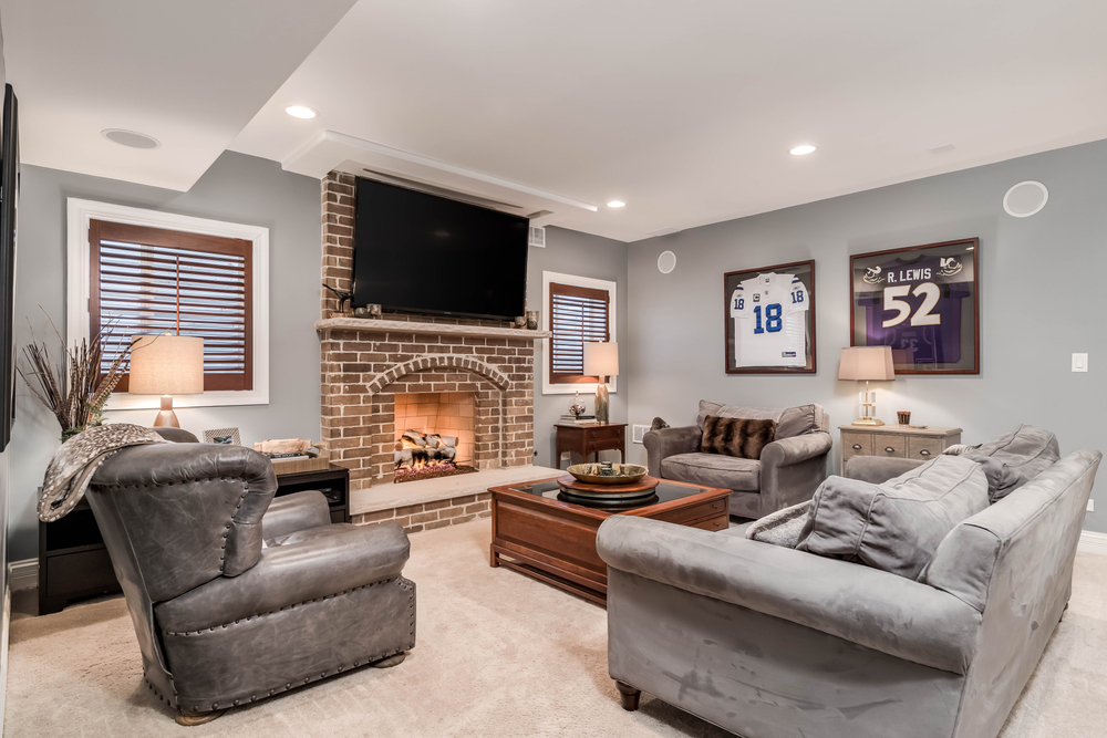 Man cave with sports jerseys on the wall