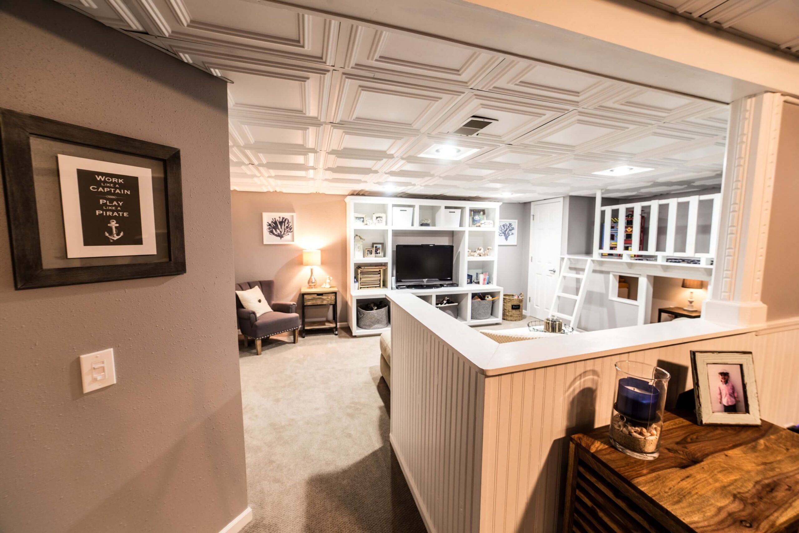 Home remodel split into two rooms consisting of a workout area and living space. Basement remodeling milwaukee Basement remodeling waukesha Basement remodeling brookfield